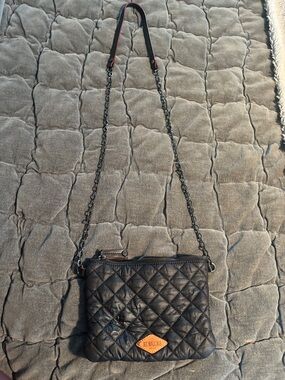 MZ Wallace Black Quilted Crossbody with Tan Leather Logo and black chain strap.